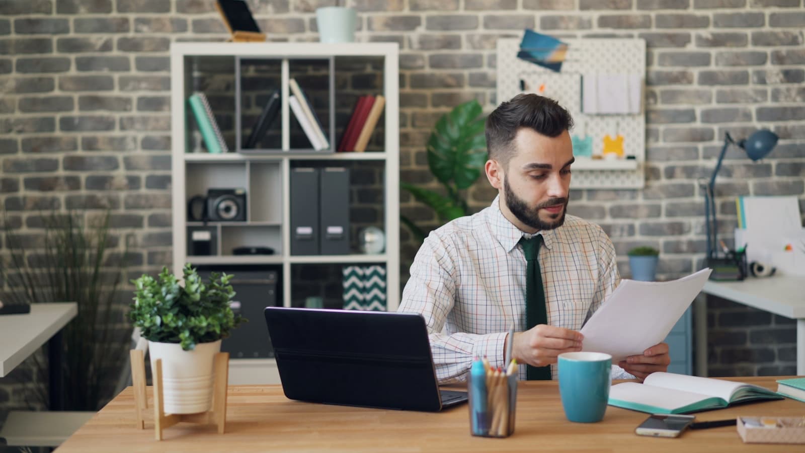 A person reviewing property documents at a desk
