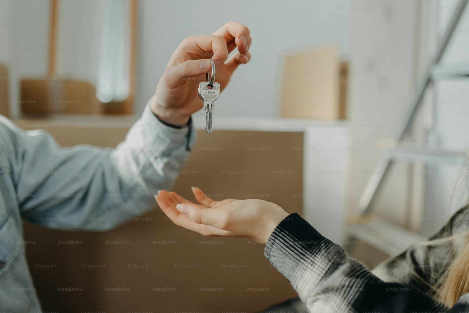A couple being handed the keys to their new home