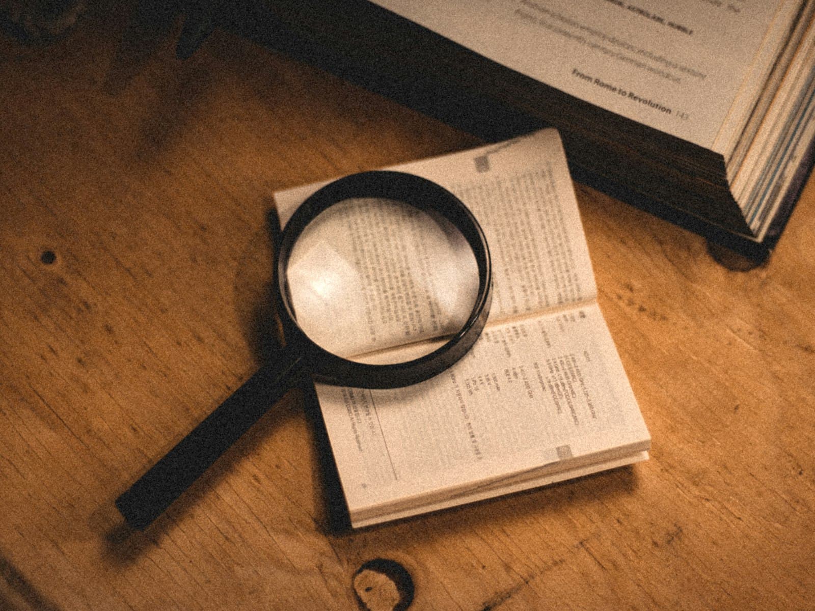A magnifying glass resting on a document