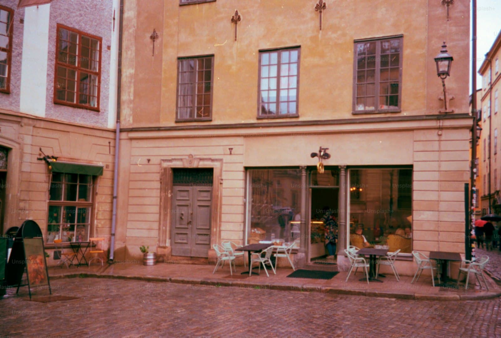 An old European café on a quiet cobblestone street