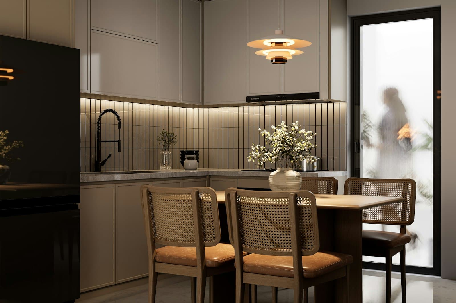 A warm, minimalist Scandinavian kitchen with cane chairs and a wooden dining table