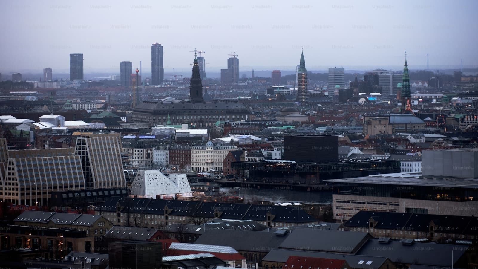 A view across a European city's rooftops from above
