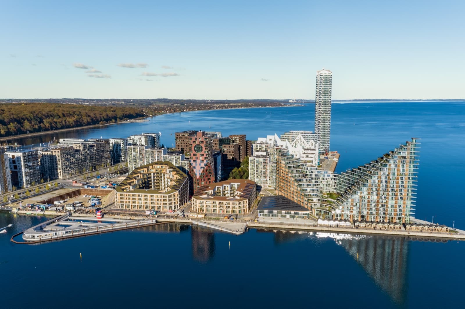 Aerial view of the Aarhus Ø harbour district in Aarhus, showing the Iceberg housing, the Lighthouse tower and the bay.