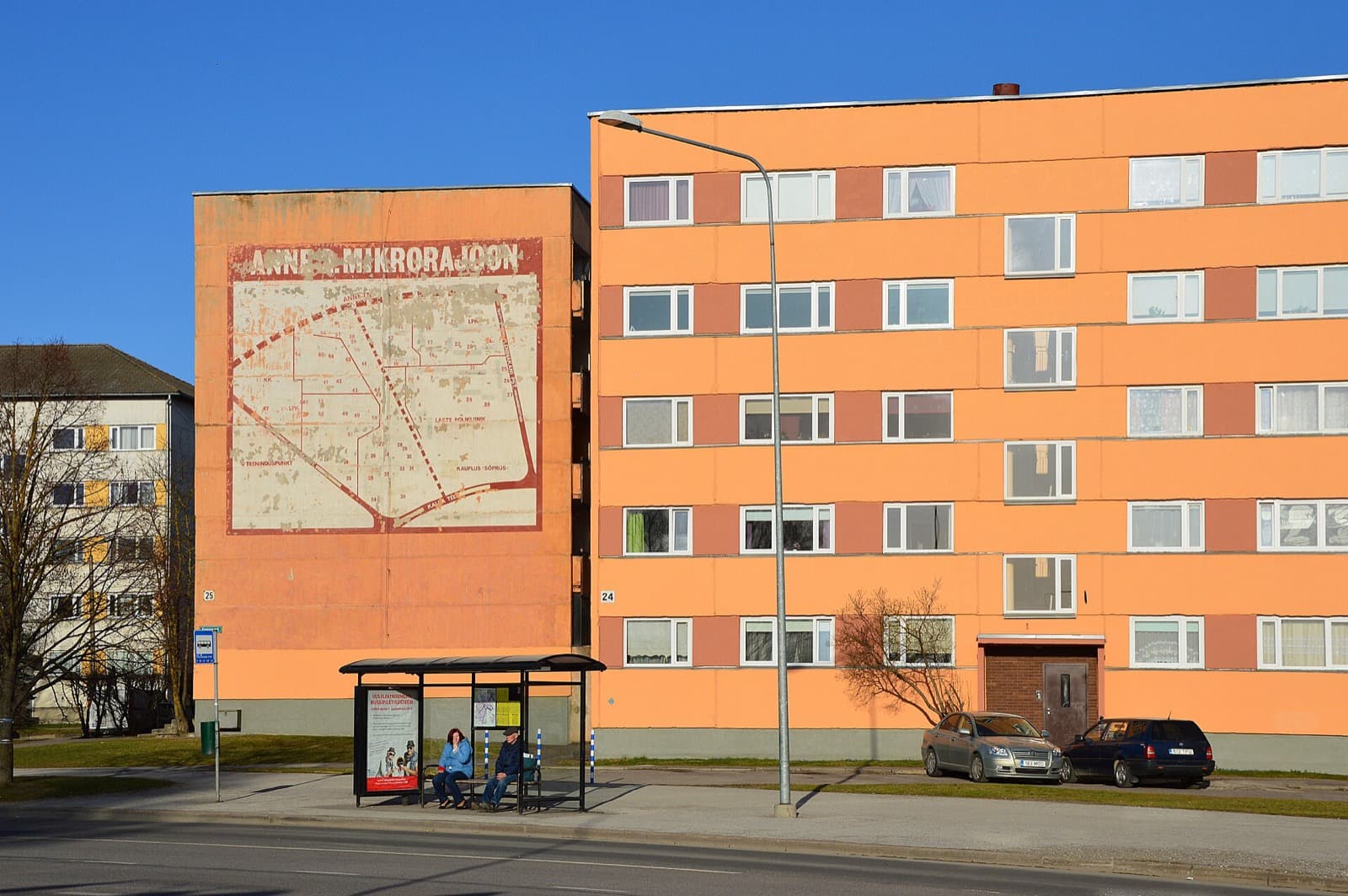 A renovated Soviet era apartment block in Annelinn, Tartu, its gable painted with a map of the Anne microdistrict.
