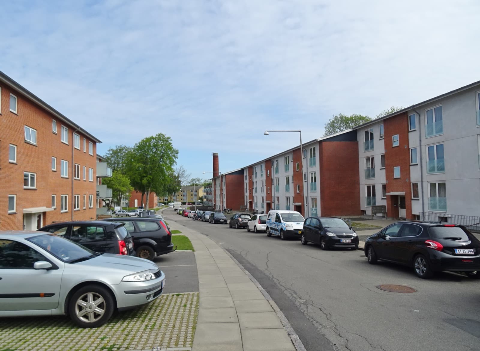 A residential street of red-brick apartment blocks in Bolbro, a western suburb of Odense.