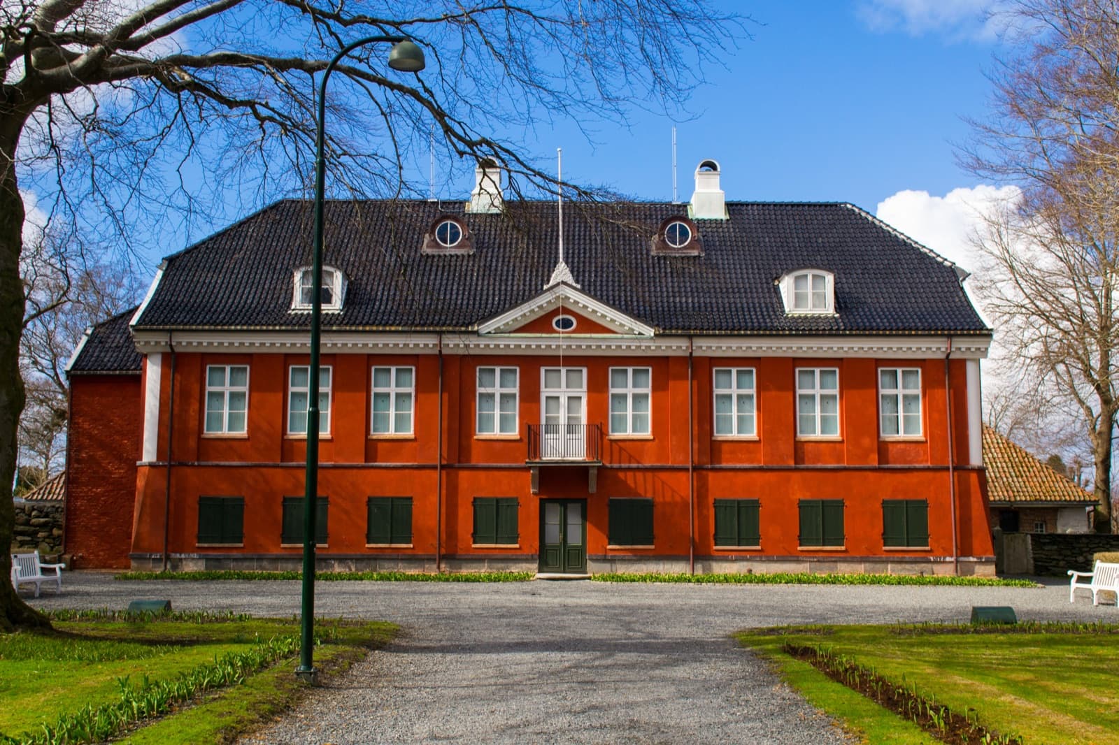 The red 1800s Ledaal manor house and its formal garden on Eiganesveien, Eiganes, Stavanger, Norway.