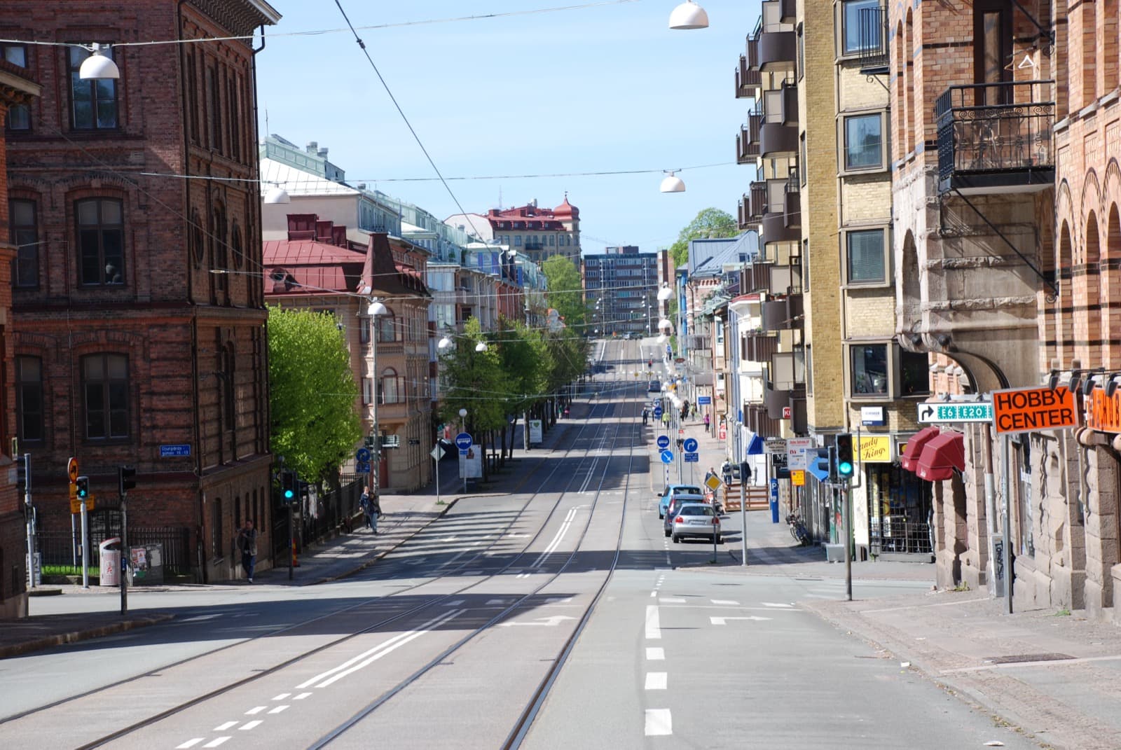Karl Johansgatan in Majorna, Göteborg, lined with the district's characteristic landshövdingehus and a tram stop.