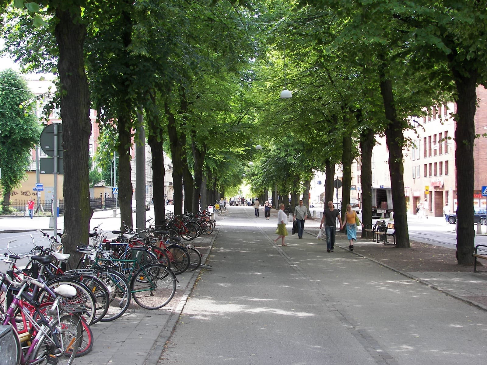 The tree-lined esplanade of Vasagatan with its preserved turn-of-the-century stone facades in Vasastaden, Göteborg.