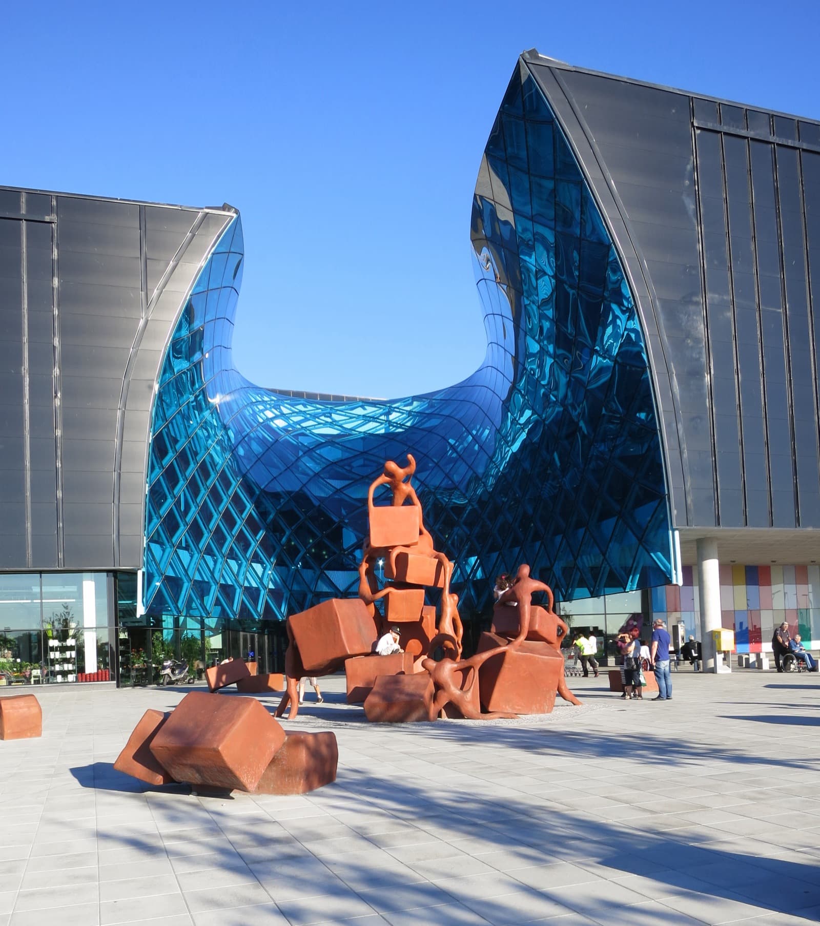 The curved amber-glass facade of the Emporia shopping centre in the Hyllie district of Malmö, Sweden.