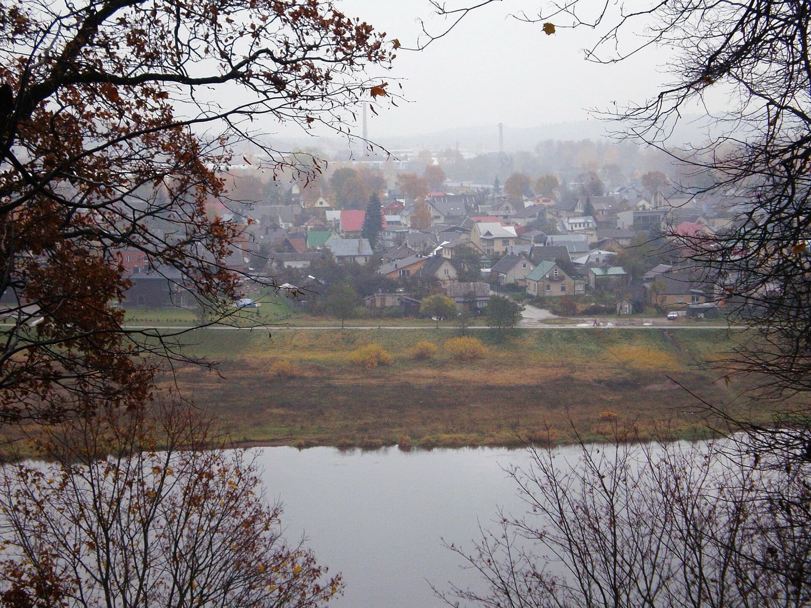 An autumn view across the Nemunas river to the low riverside houses of Šančiai, Kaunas.
