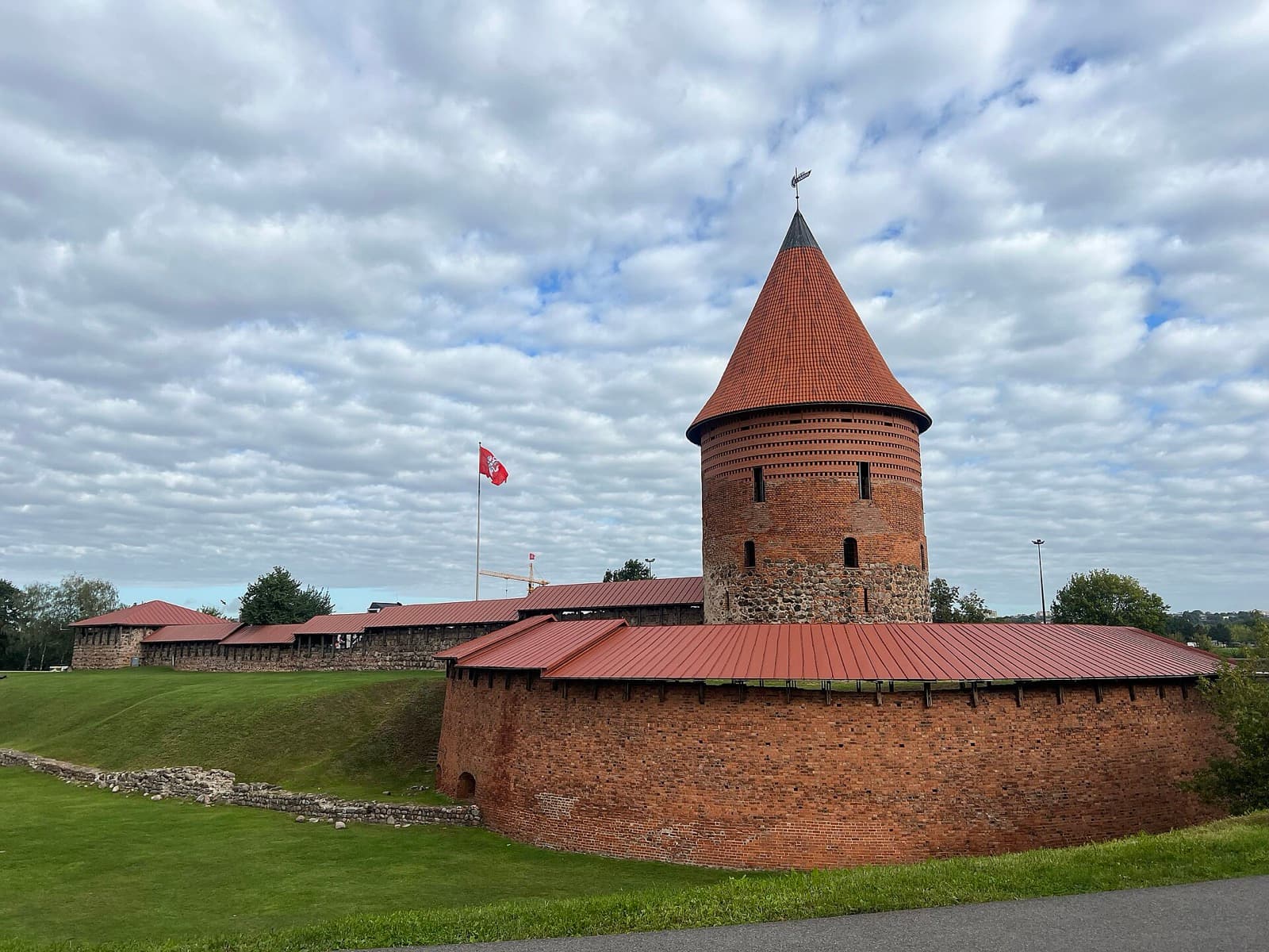 The red-brick round tower and walls of Kaunas Castle at the edge of the Old Town, Kaunas.