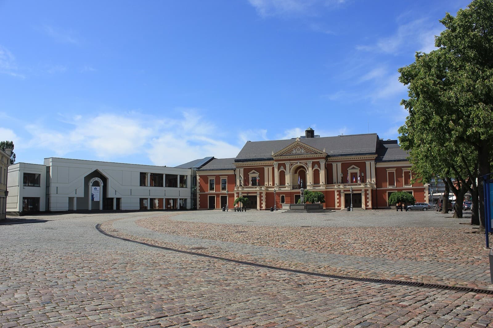 Theatre Square in Klaipėda Old Town, the cobbled main square with the red Drama Theatre building