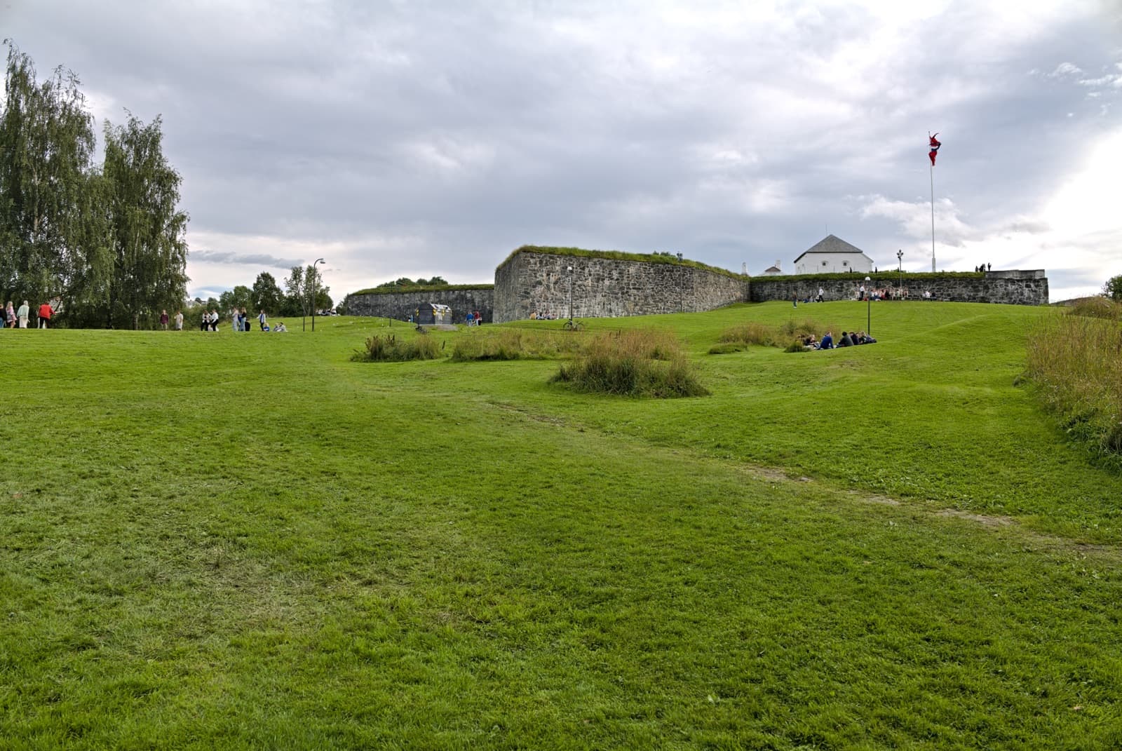 The grassy ramparts and stone walls of Kristiansten fortress on the hill at the north edge of Singsaker, Trondheim, Norway.
