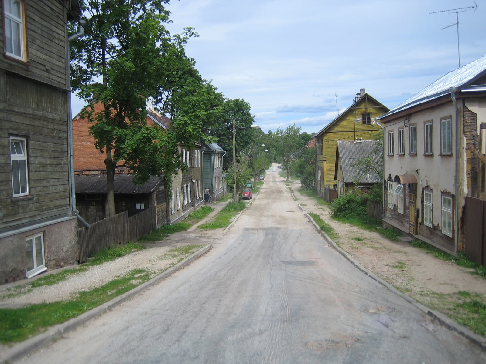 A quiet street of old wooden houses in Supilinn, Tartu's low rise riverside district.