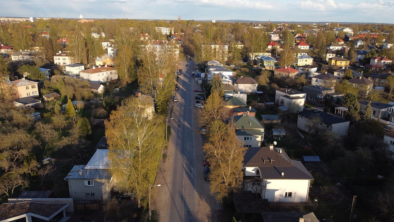 An aerial view over the leafy villa streets of Tähtvere in Tartu on a spring day.
