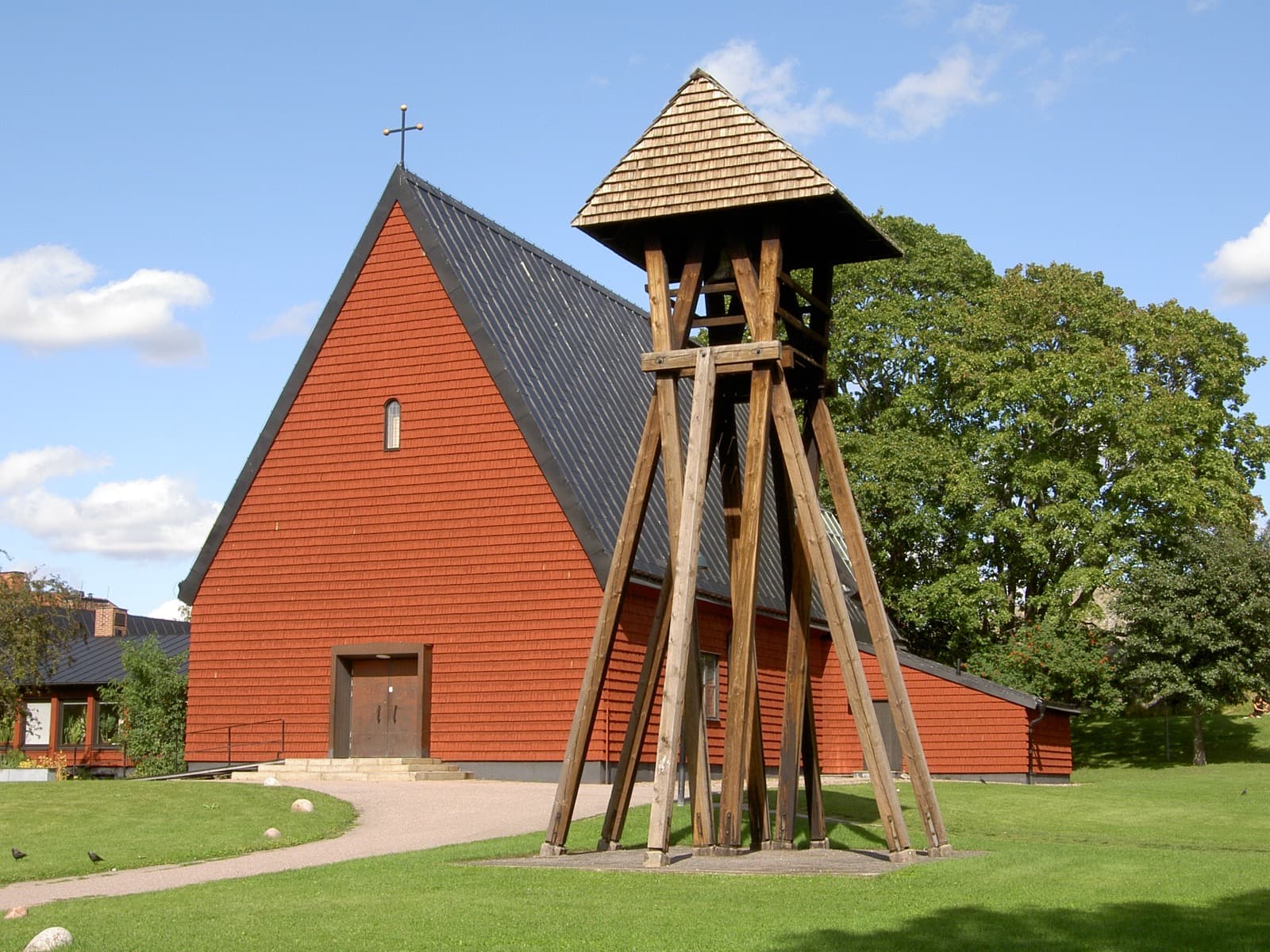 Salabacke Church (Salabackekyrkan) with its free-standing bell tower, a 1950s landmark in the Sala backe district of Uppsala, Sweden.