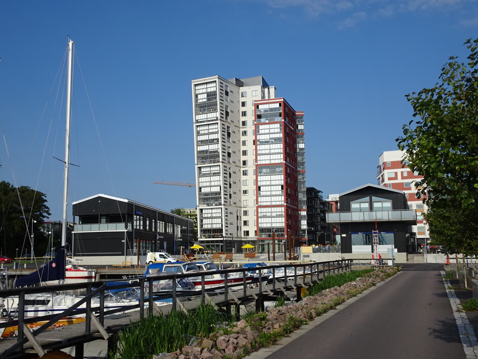 The waterfront district of Öster Mälarstrand on Lake Mälaren in Västerås, Sweden, with modern apartment blocks along the shore.