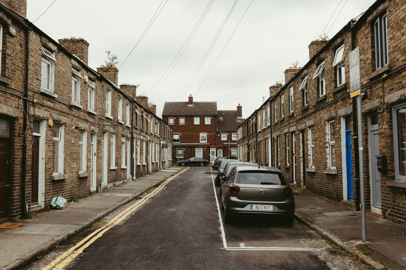 A row of similar traditional terraced houses on a European street