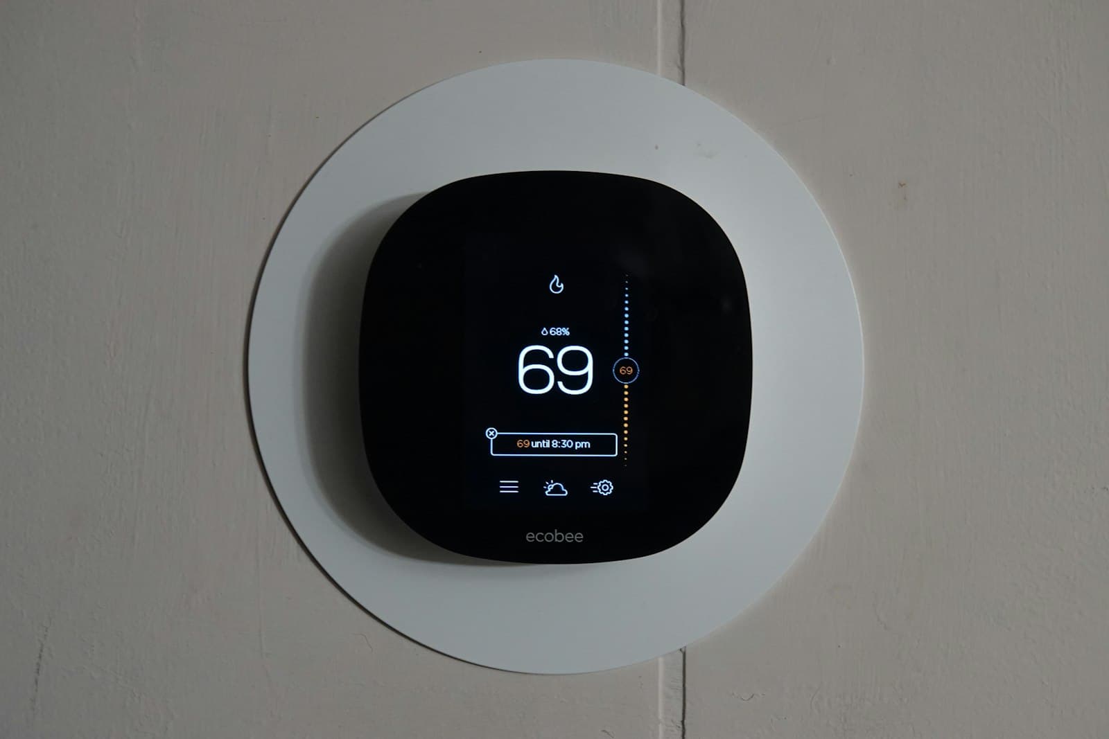 A smart heating thermostat on a wall