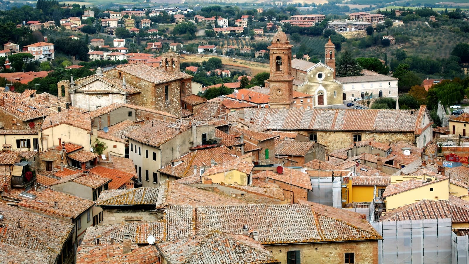 Warm terracotta rooftops of a hilltop European town